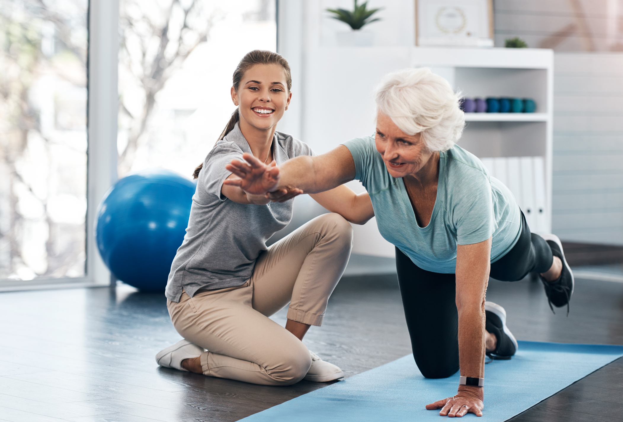 Shot of a senior woman being treated by a physiotherapist